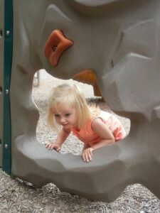 Child in playground rocks